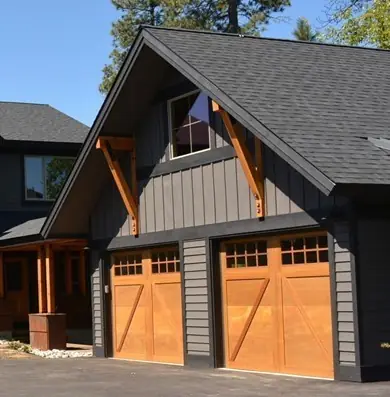 Craftsman garage with two cedar carriage doors